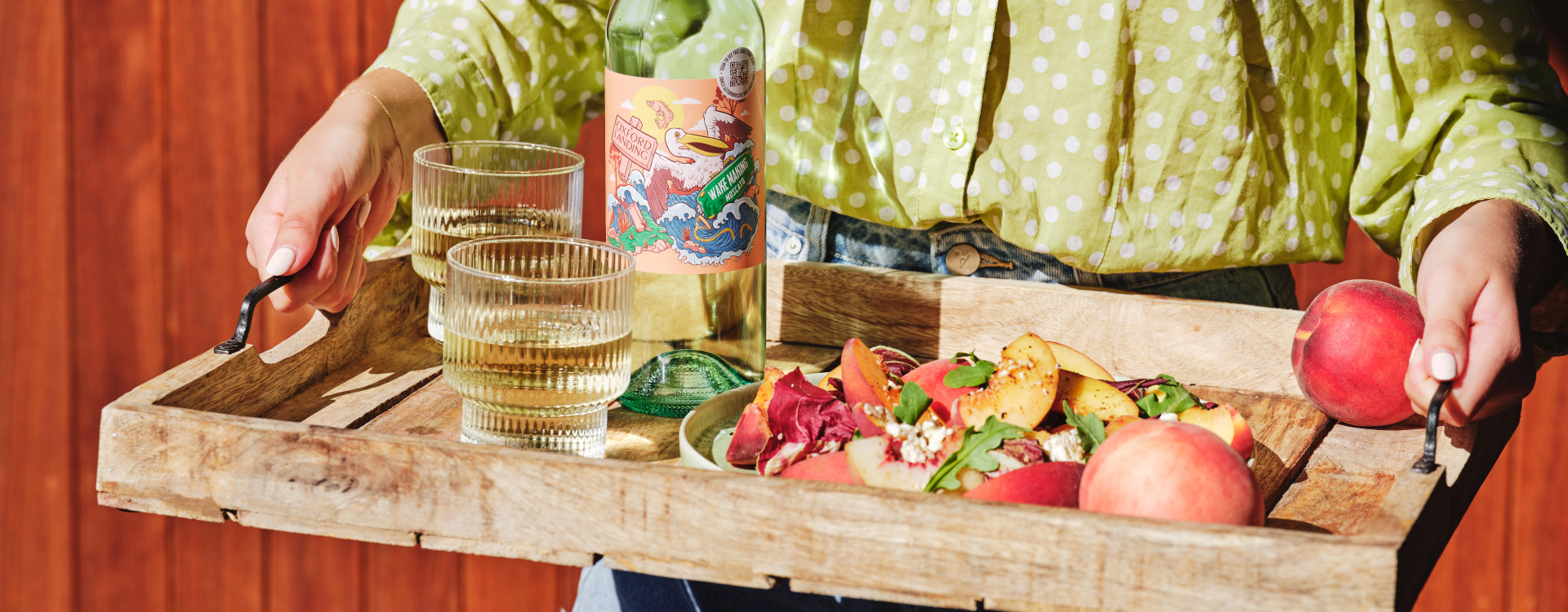 There's no better way to celebrate the season than with a delectable peach salad paired with a bottle of Riverlife Wake Making Moscato.