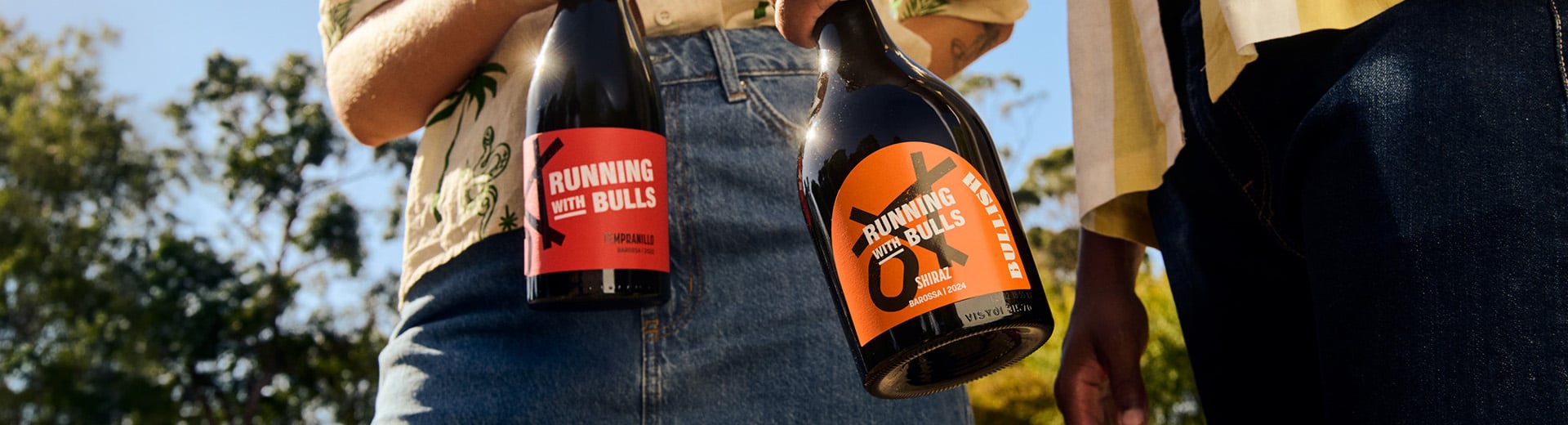 an image featuring young people enjoying a bottle of running with bulls bullish shiraz and running with bulls tempranillo