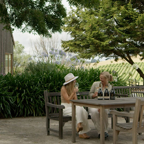Jansz Winemaker Jennifer Doyle chatting with Left off the Map host Holly Bowden in front of the Jansz Tasmania Wine Room